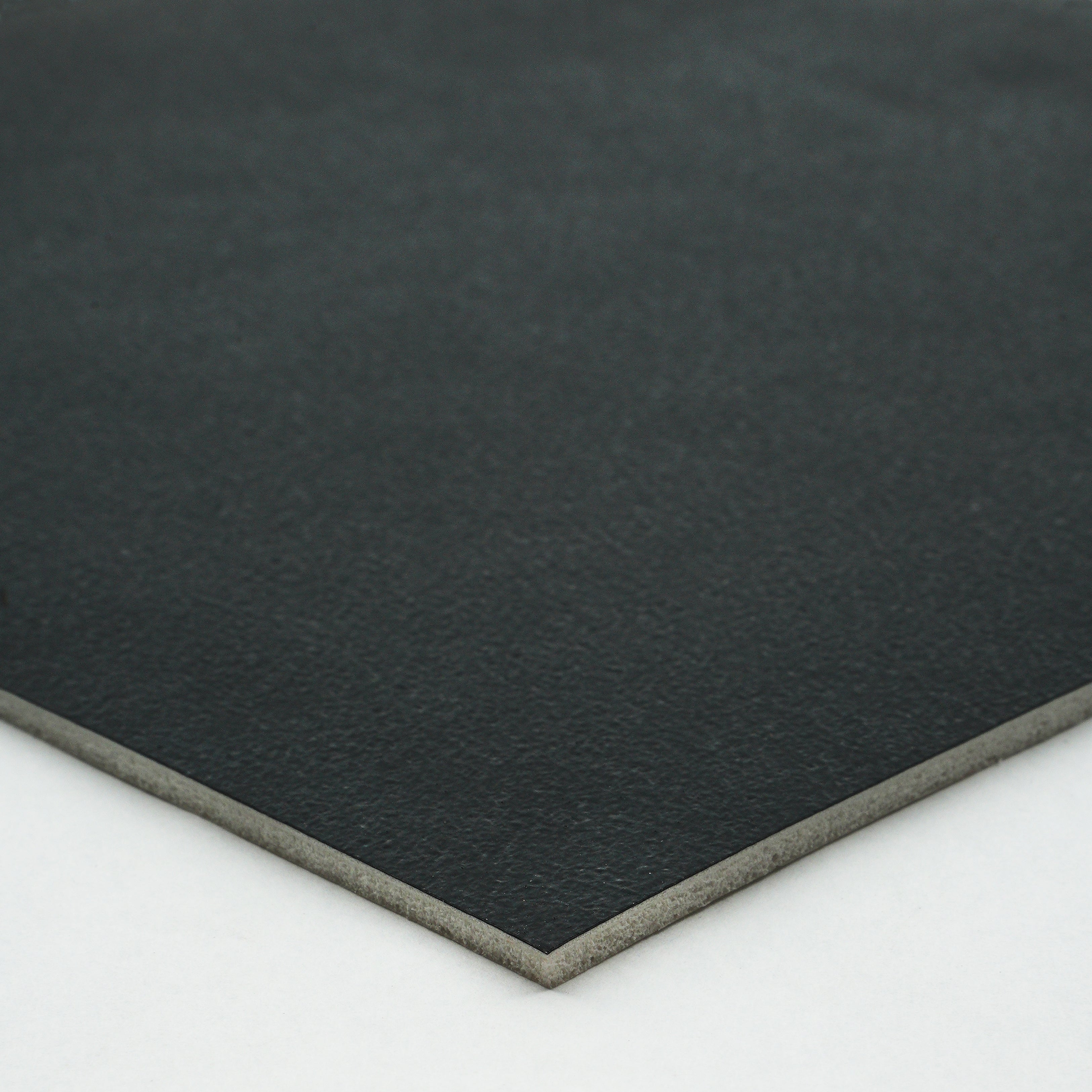 Black premium leatherette sheet with smooth texture and sturdy backing, ideal for crafting and upholstery.